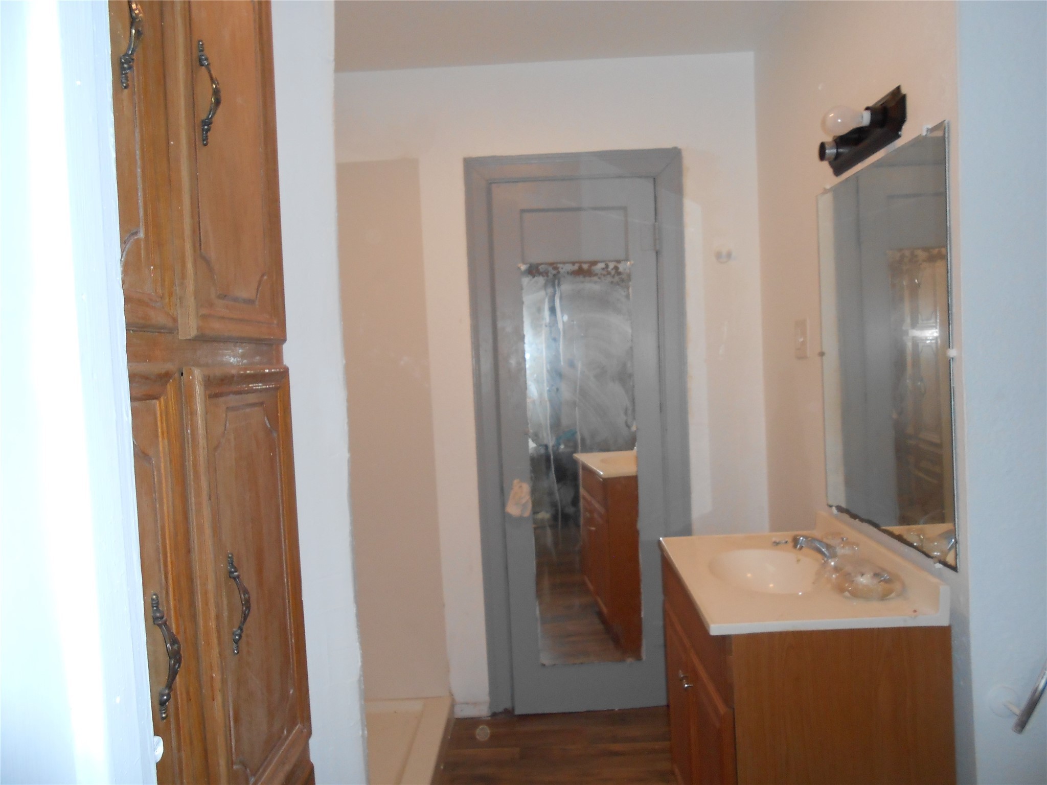 930 West 5th Street Port Arthur, TX 77640 - Photo 11 of 15 a bathroom with a sink and mirror