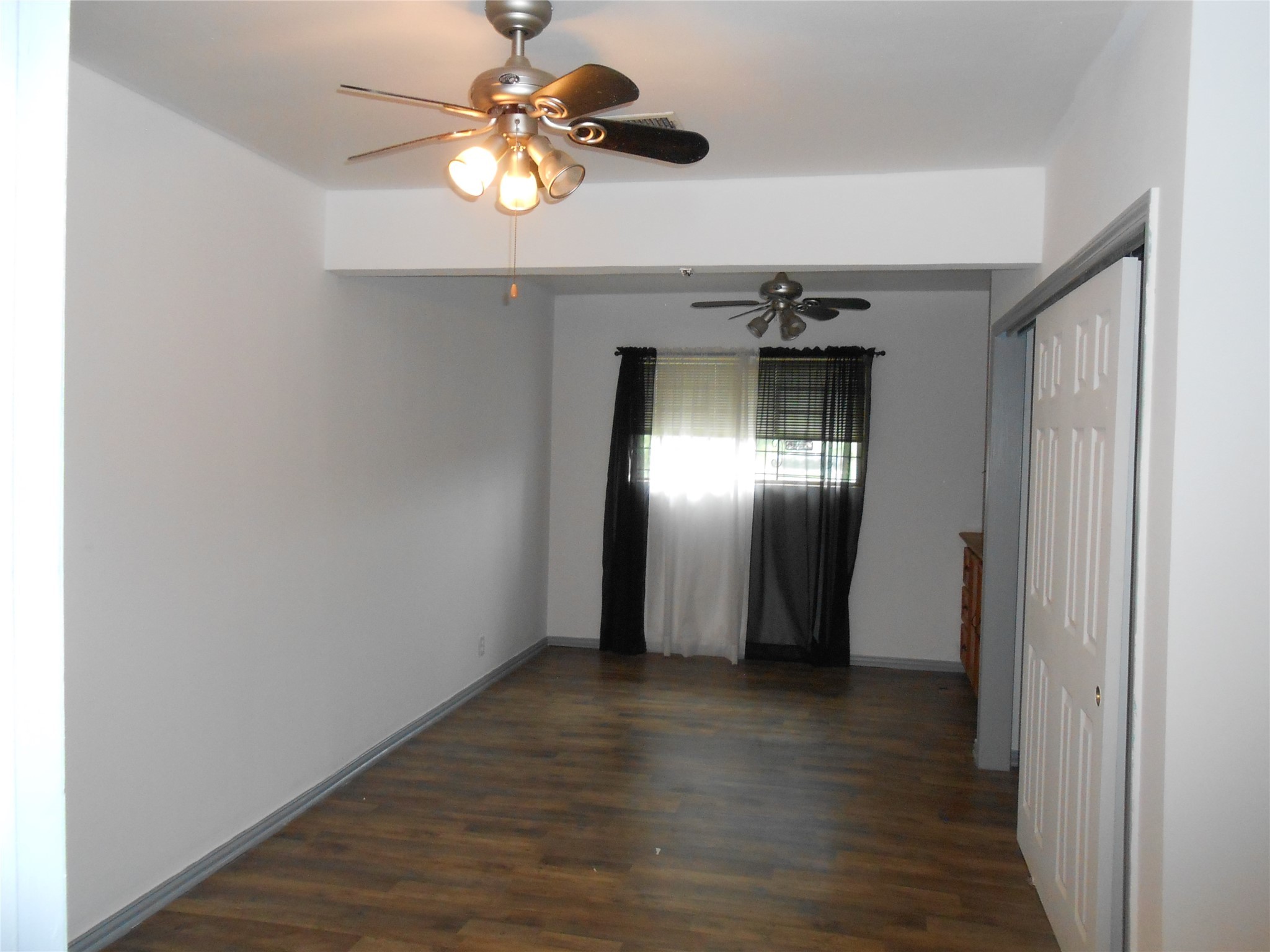 930 West 5th Street Port Arthur, TX 77640 - Photo 14 of 15 a view of a hallway with wooden floor