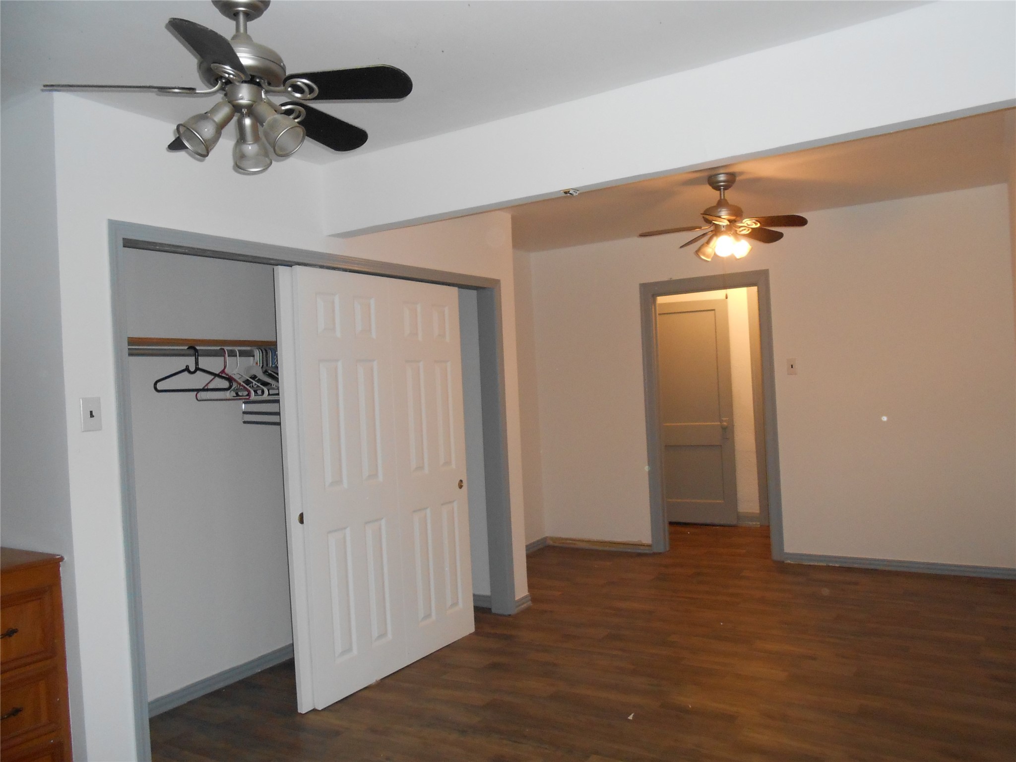 930 West 5th Street Port Arthur, TX 77640 - Photo 15 of 15 a view of a livingroom with a chandelier fan and wooden floor