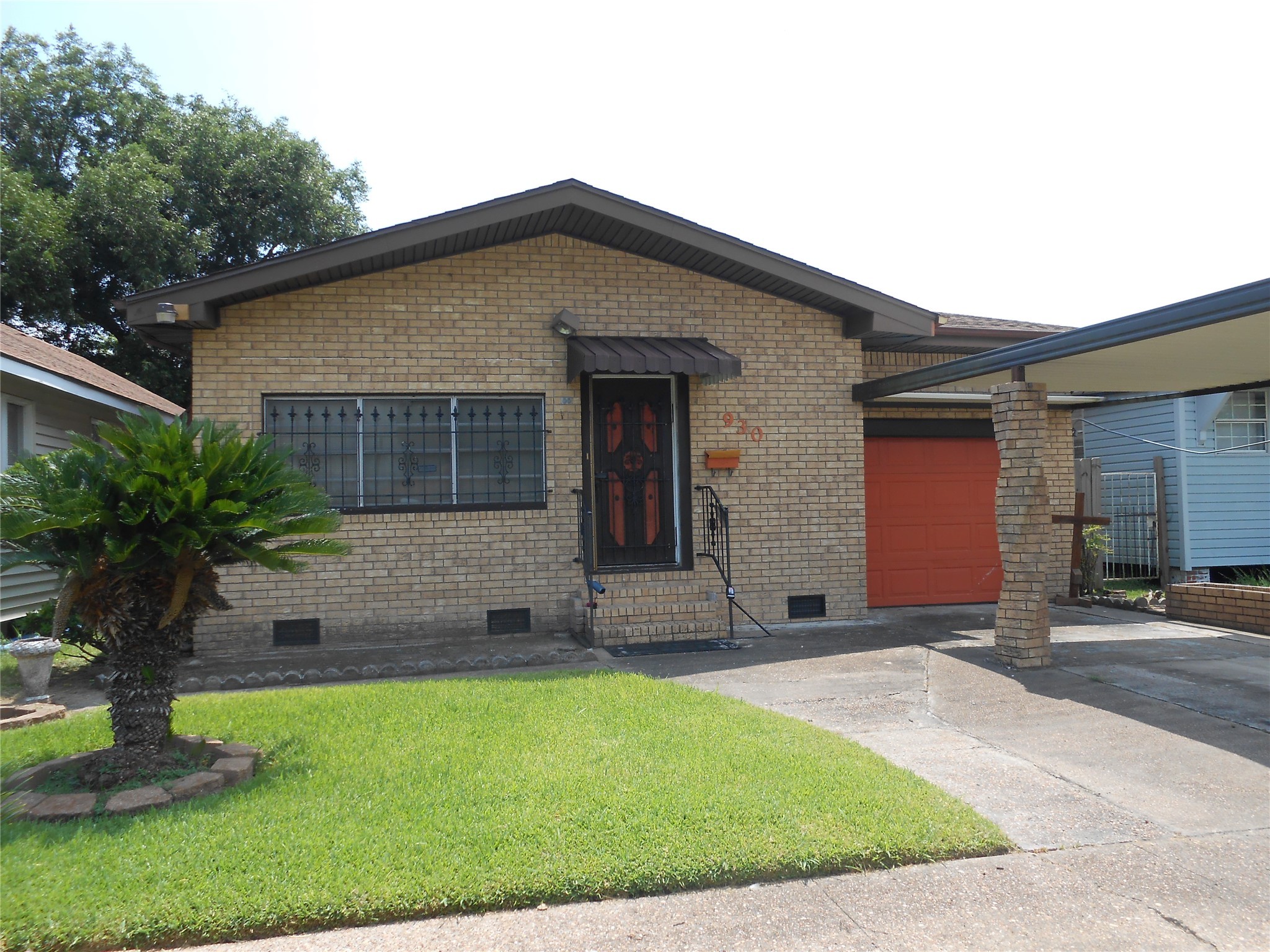 930 West 5th Street Port Arthur, TX 77640 - Photo 2 of 15 a front view of a house with garden