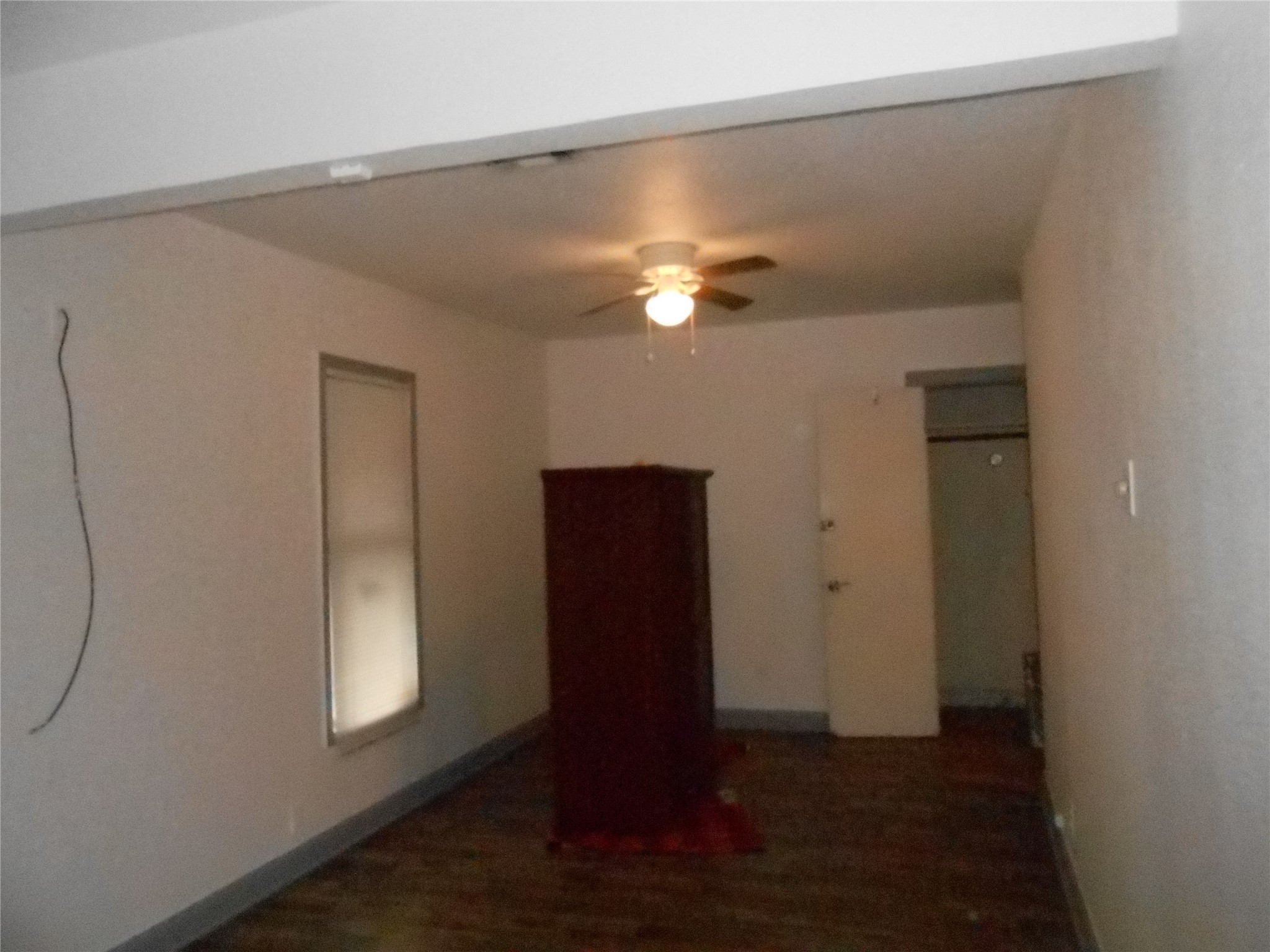 930 West 5th Street Port Arthur, TX 77640 - Photo 9 of 15 an empty room with wooden floor closet and windows