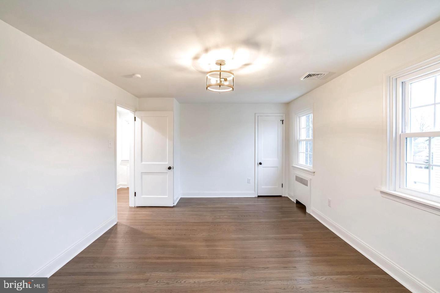 115 Beech Road Wallingford, PA 19086 - Photo 22 of 29 wooden floor in an empty room with a window