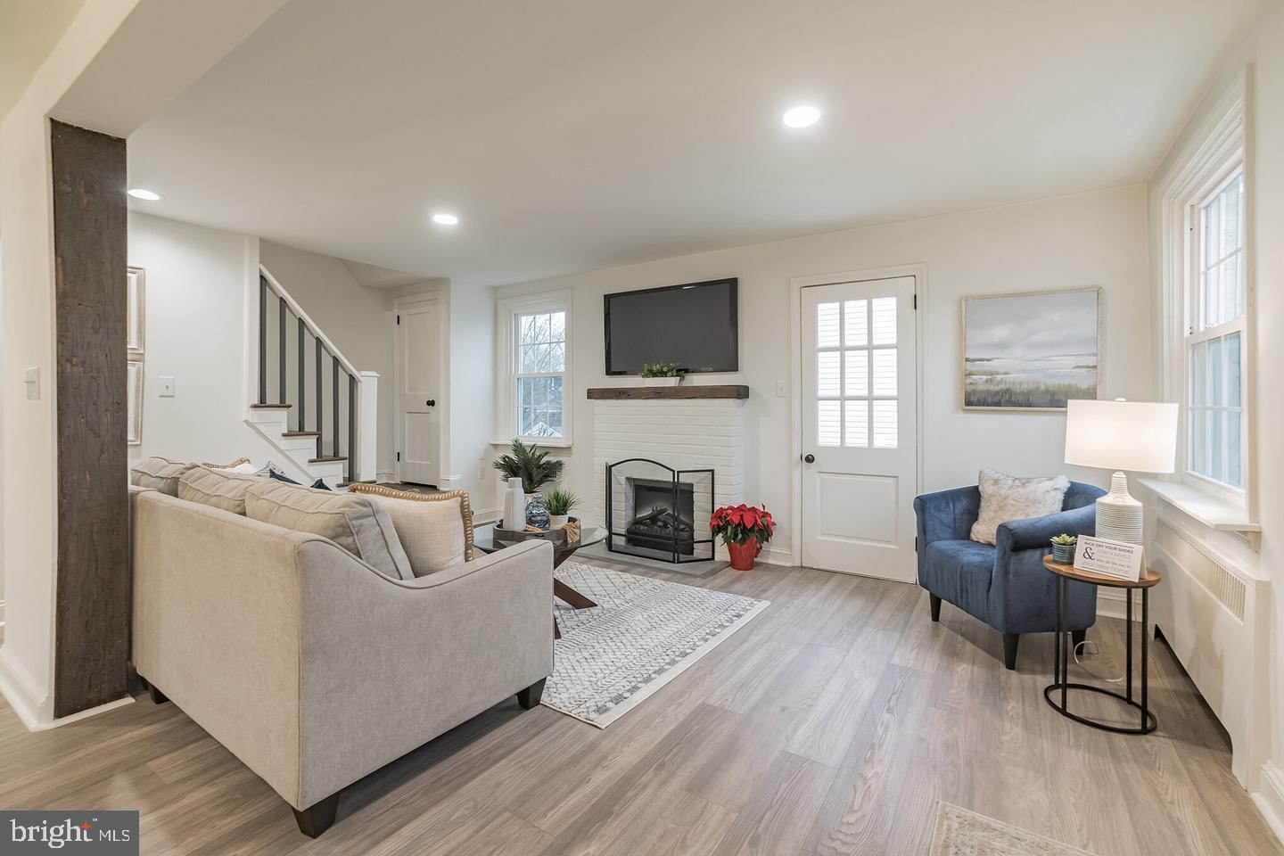 115 Beech Road Wallingford, PA 19086 - Photo 5 of 29 a living room with furniture and a fireplace