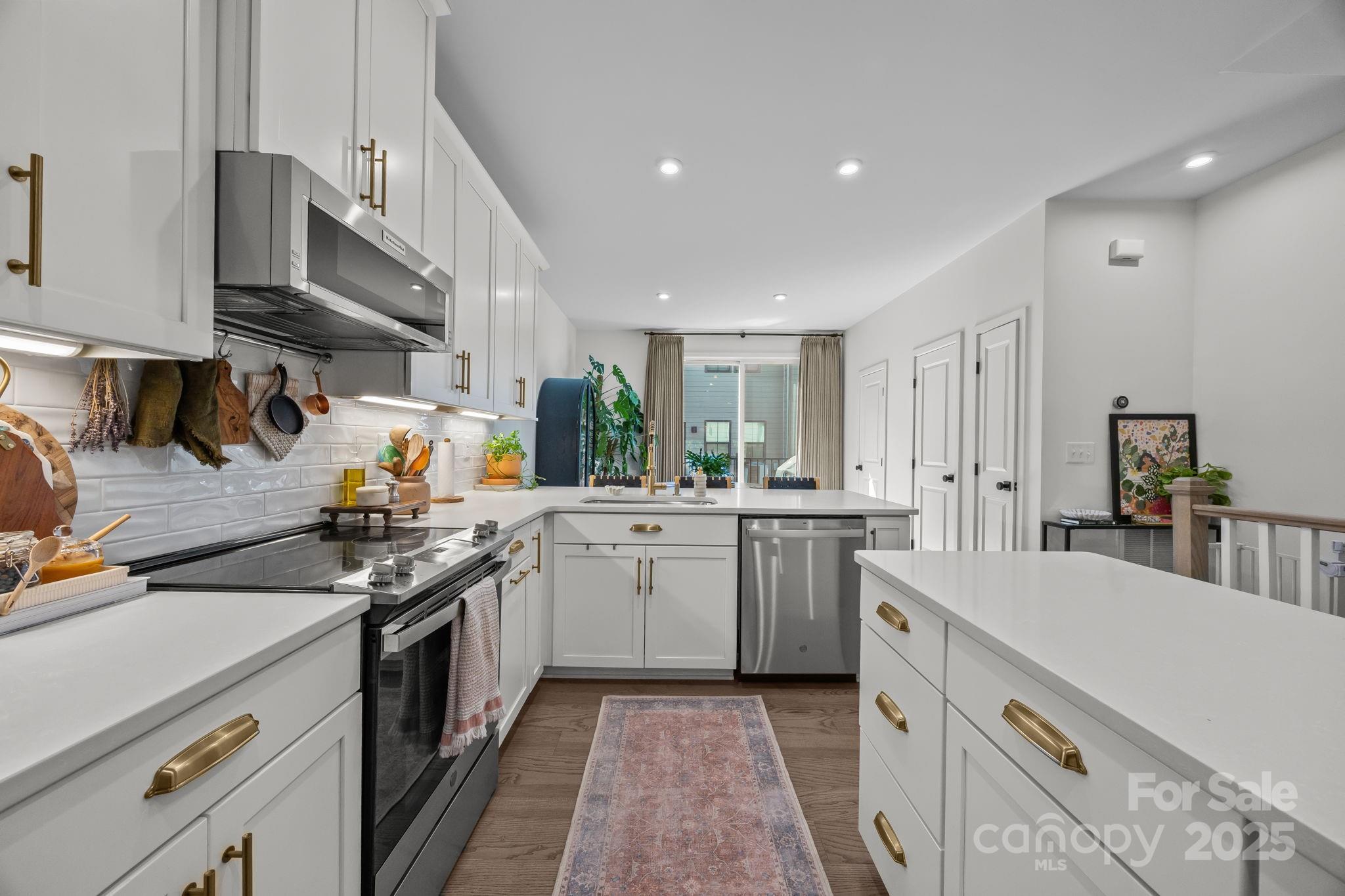 544 Billingsley Road Charlotte, NC 28211 - Photo 12 of 24 a kitchen with a sink stove and cabinets