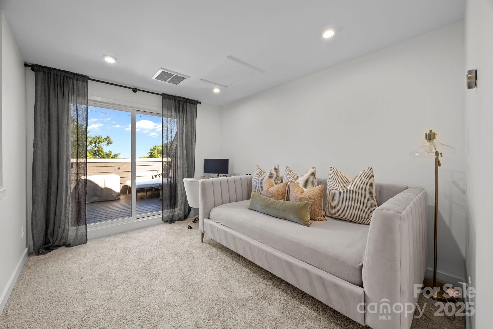 544 Billingsley Road Charlotte, NC 28211 - Photo 19 of 24 a living room with furniture and a large window