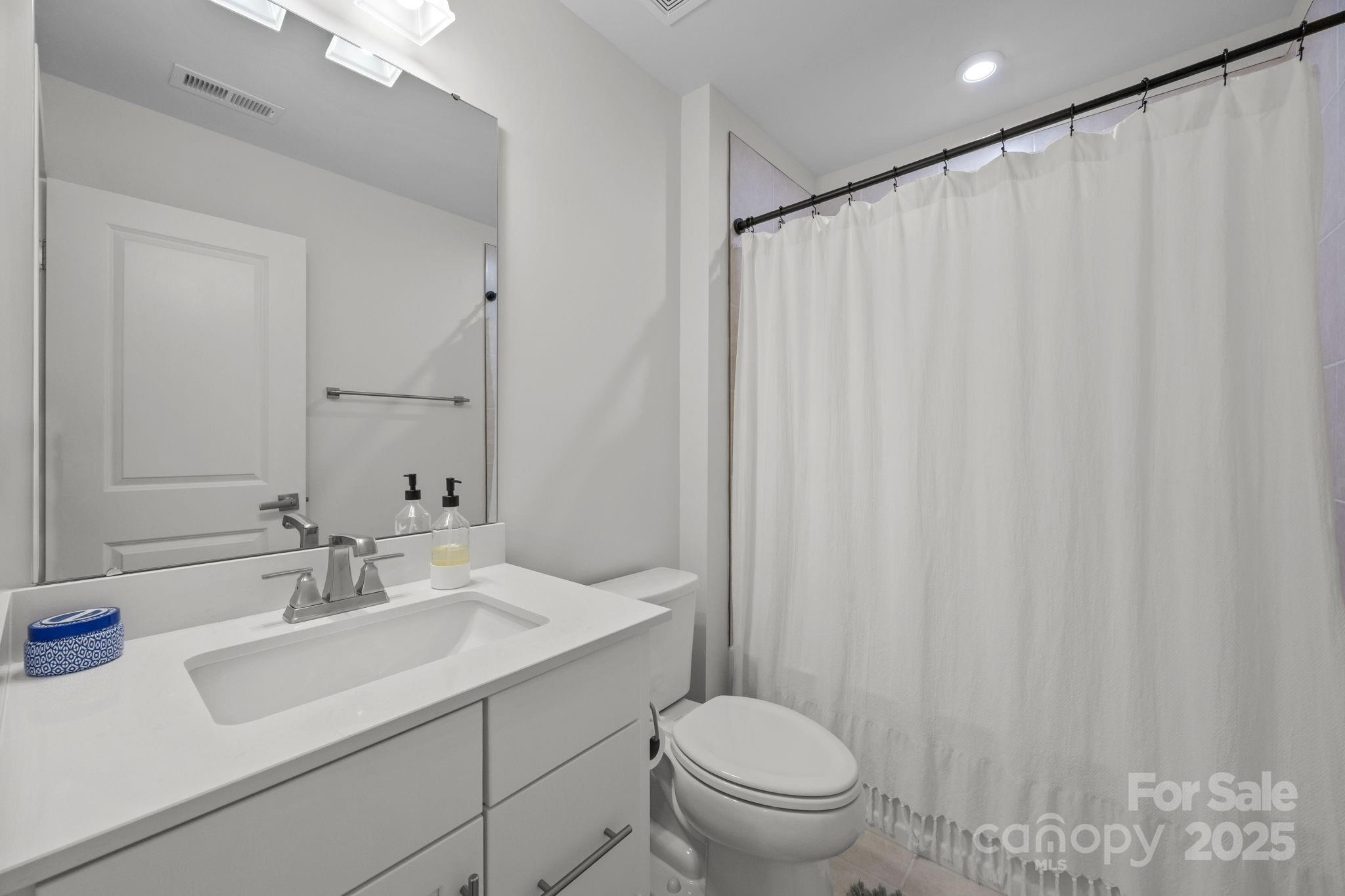 544 Billingsley Road Charlotte, NC 28211 - Photo 20 of 24 a bathroom with a sink toilet and shower