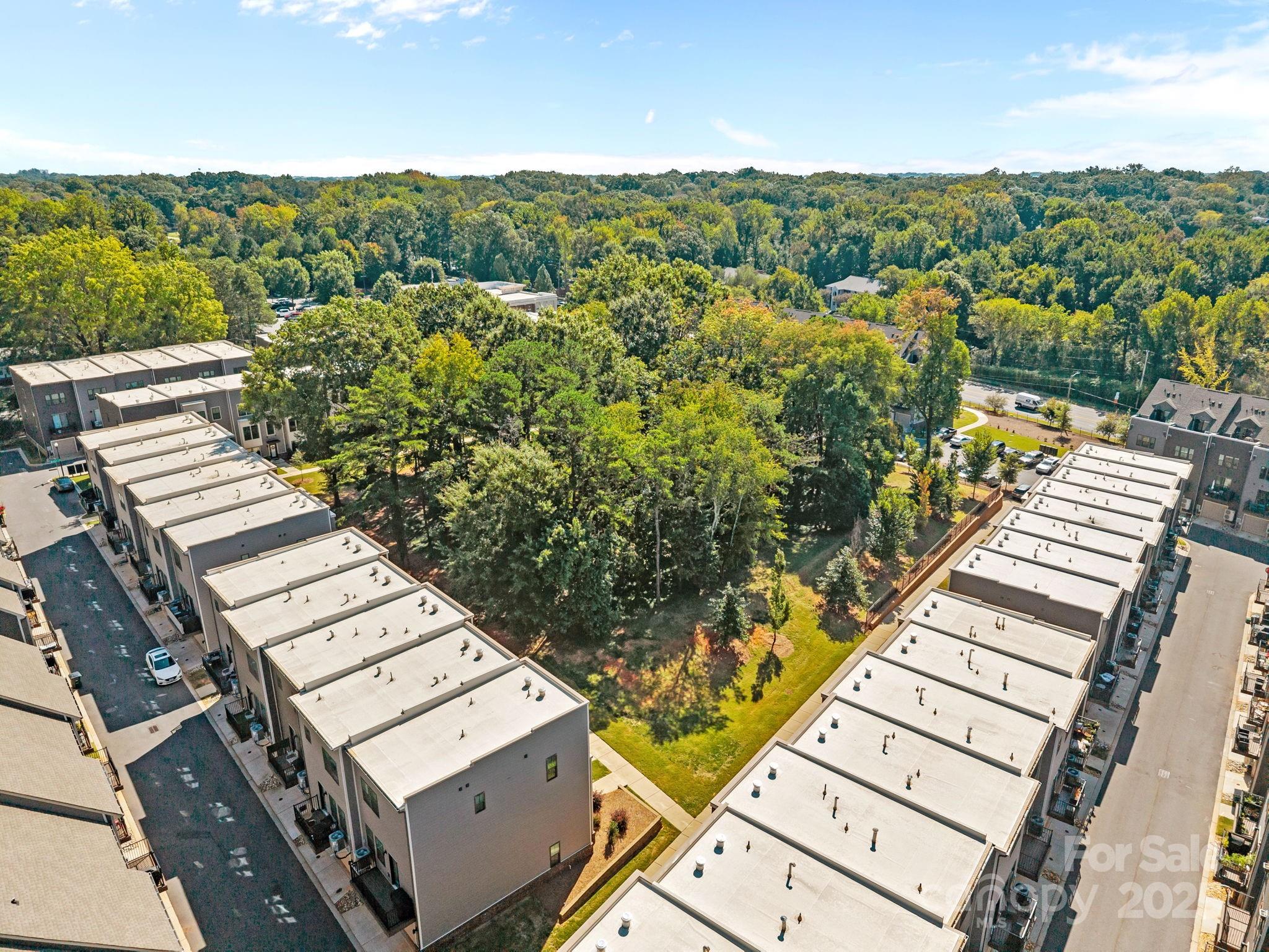 544 Billingsley Road Charlotte, NC 28211 - Photo 24 of 24 an aerial view of a residential apartment building with a yard