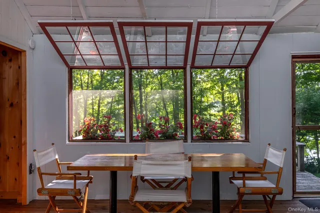 a view of a dining room with furniture window and outside view