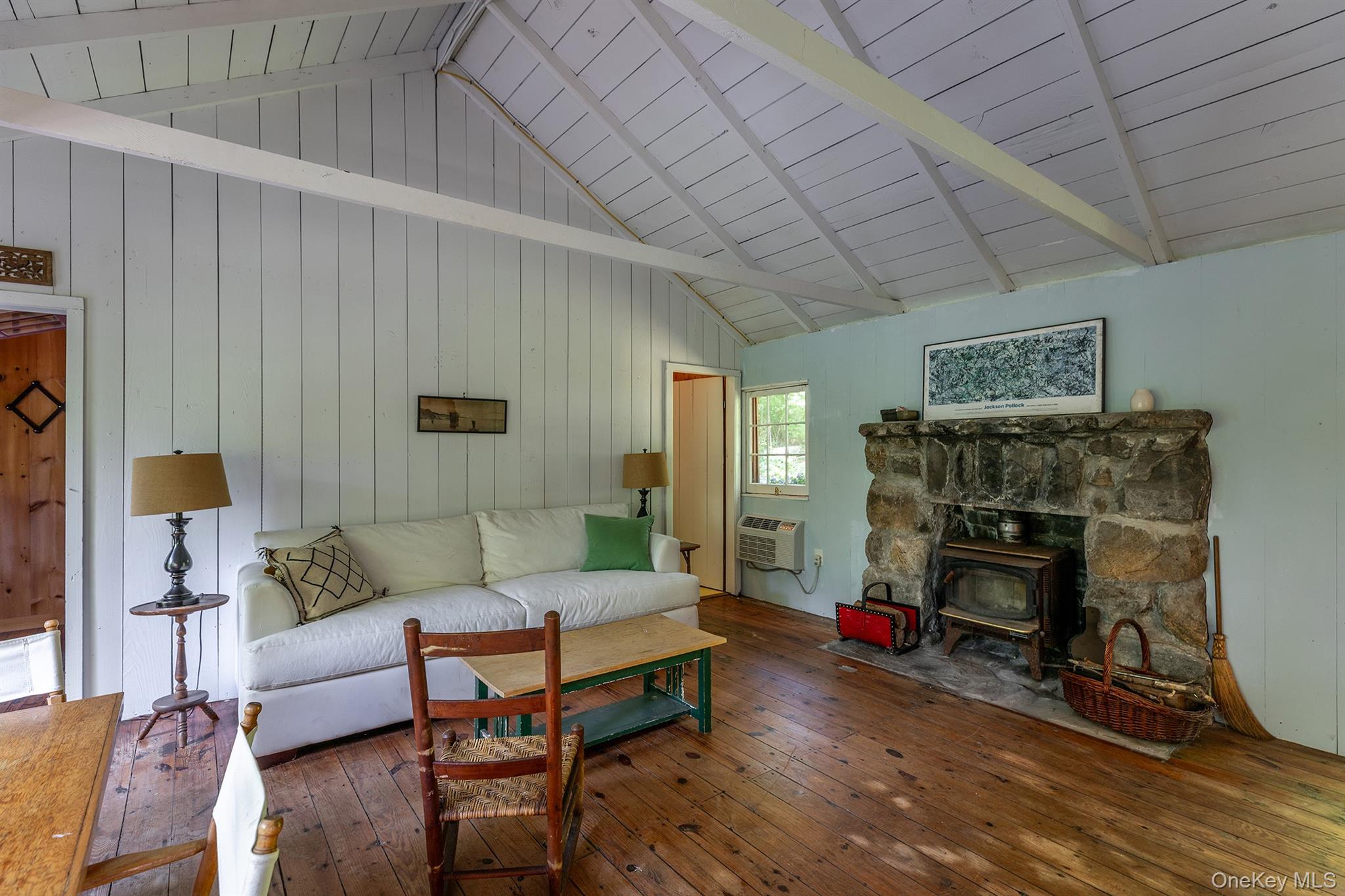 Undisclosed Address Brewster, NY 10509 - Photo 12 of 39 a living room with furniture and a fireplace