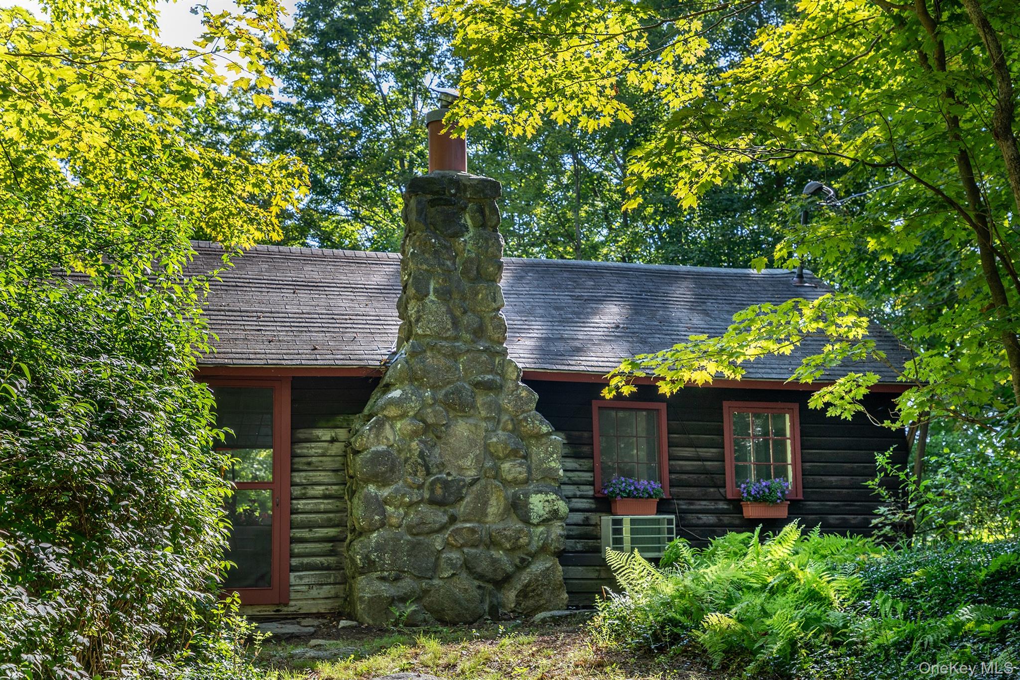 Undisclosed Address Brewster, NY 10509 - Photo 14 of 39 a view of a backyard with plants