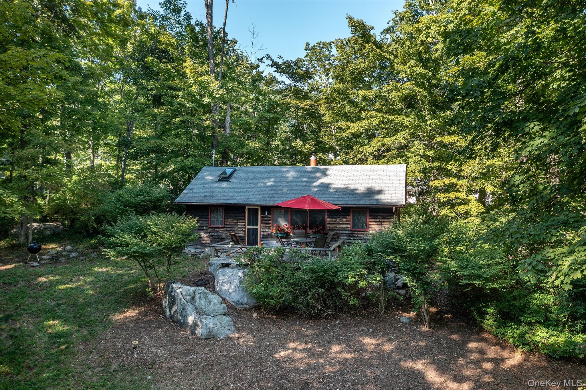 Undisclosed Address Brewster, NY 10509 - Photo 16 of 39 a view of a big yard with plants and large trees