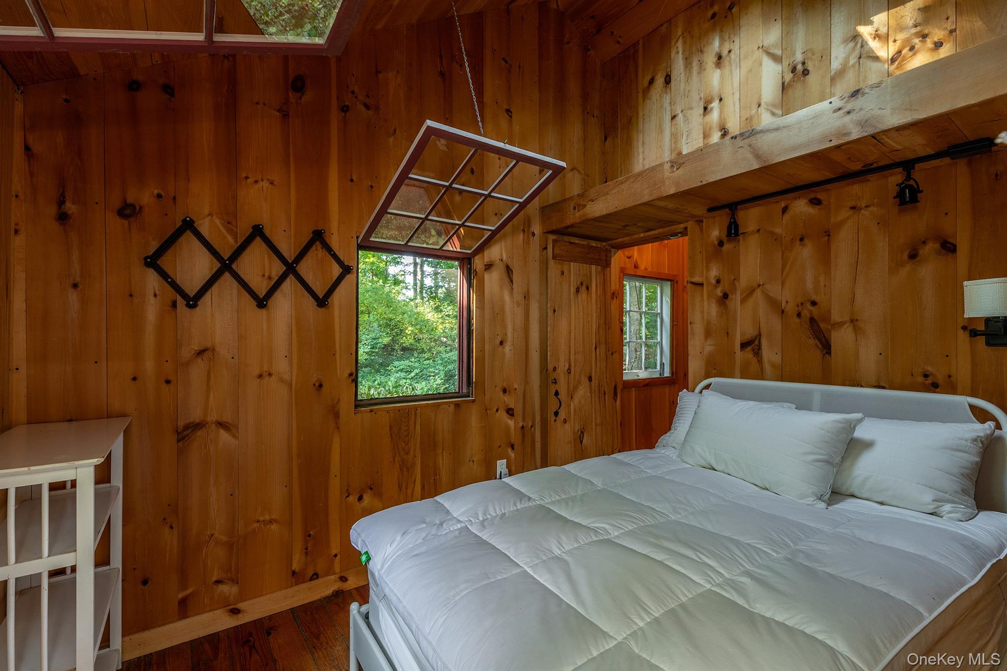 Undisclosed Address Brewster, NY 10509 - Photo 20 of 39 a bedroom with a bed and a window