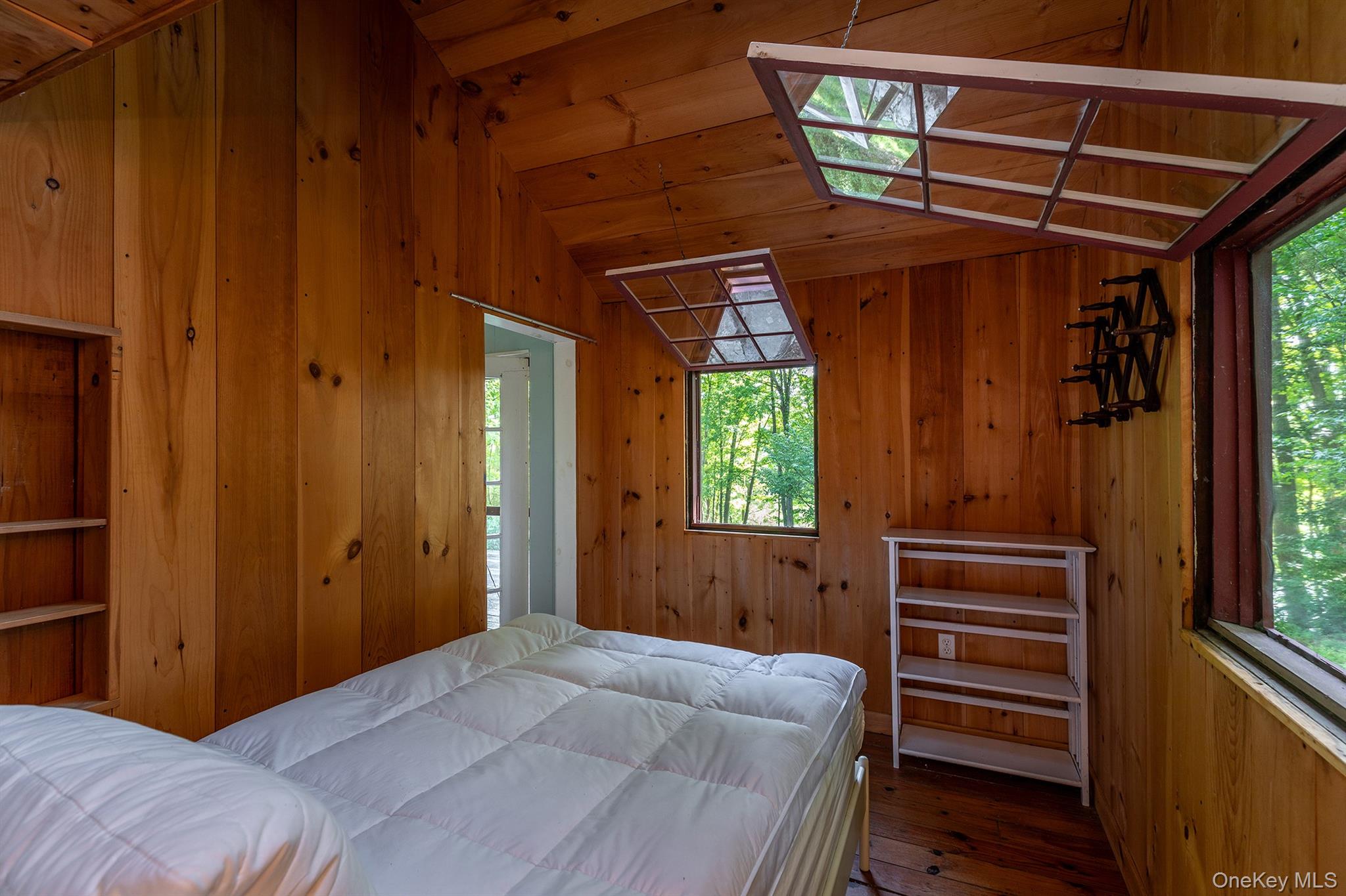 Undisclosed Address Brewster, NY 10509 - Photo 22 of 39 a bedroom with a bed and a window