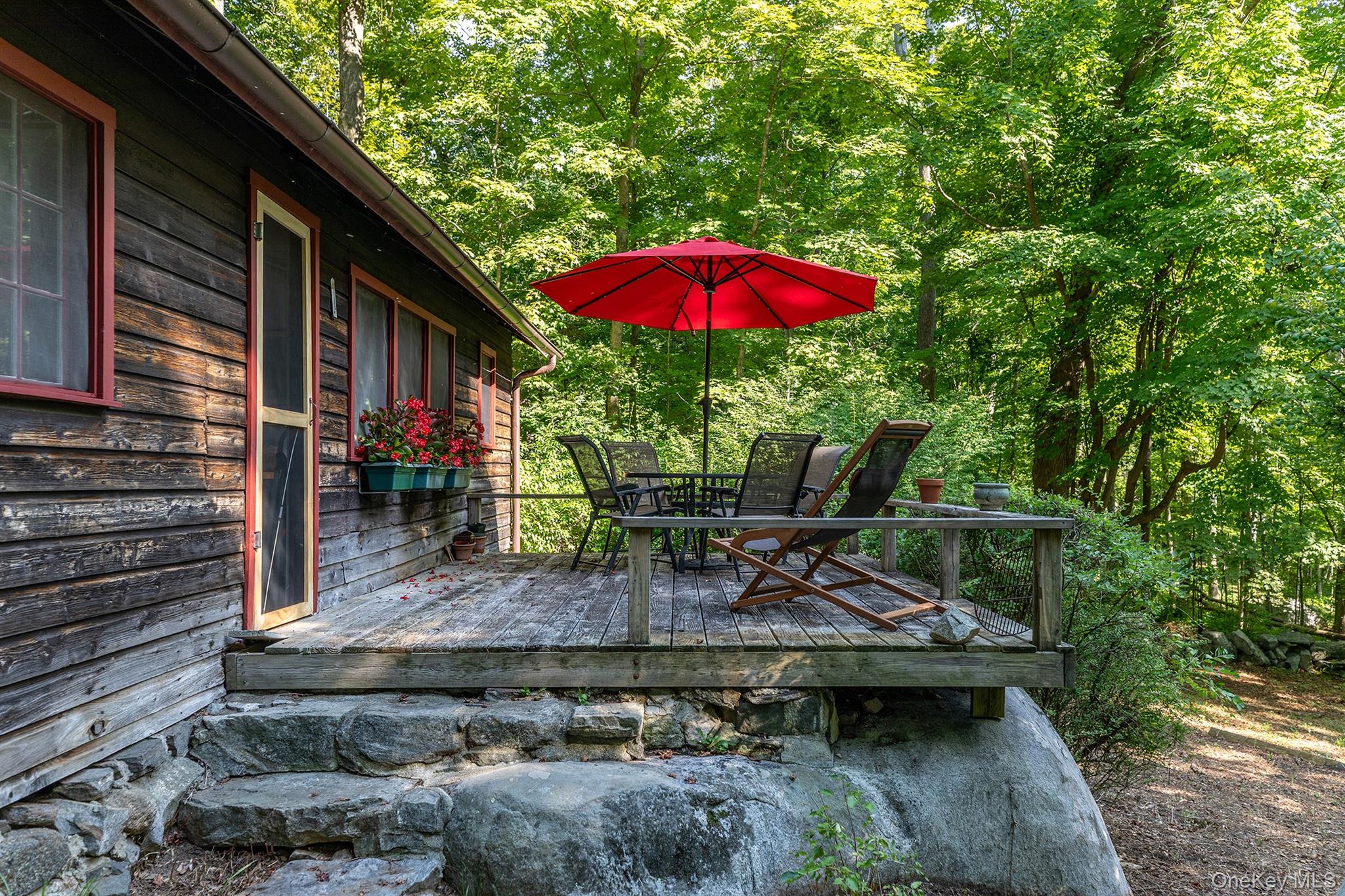 Undisclosed Address Brewster, NY 10509 - Photo 27 of 39 a view of a backyard with a patio