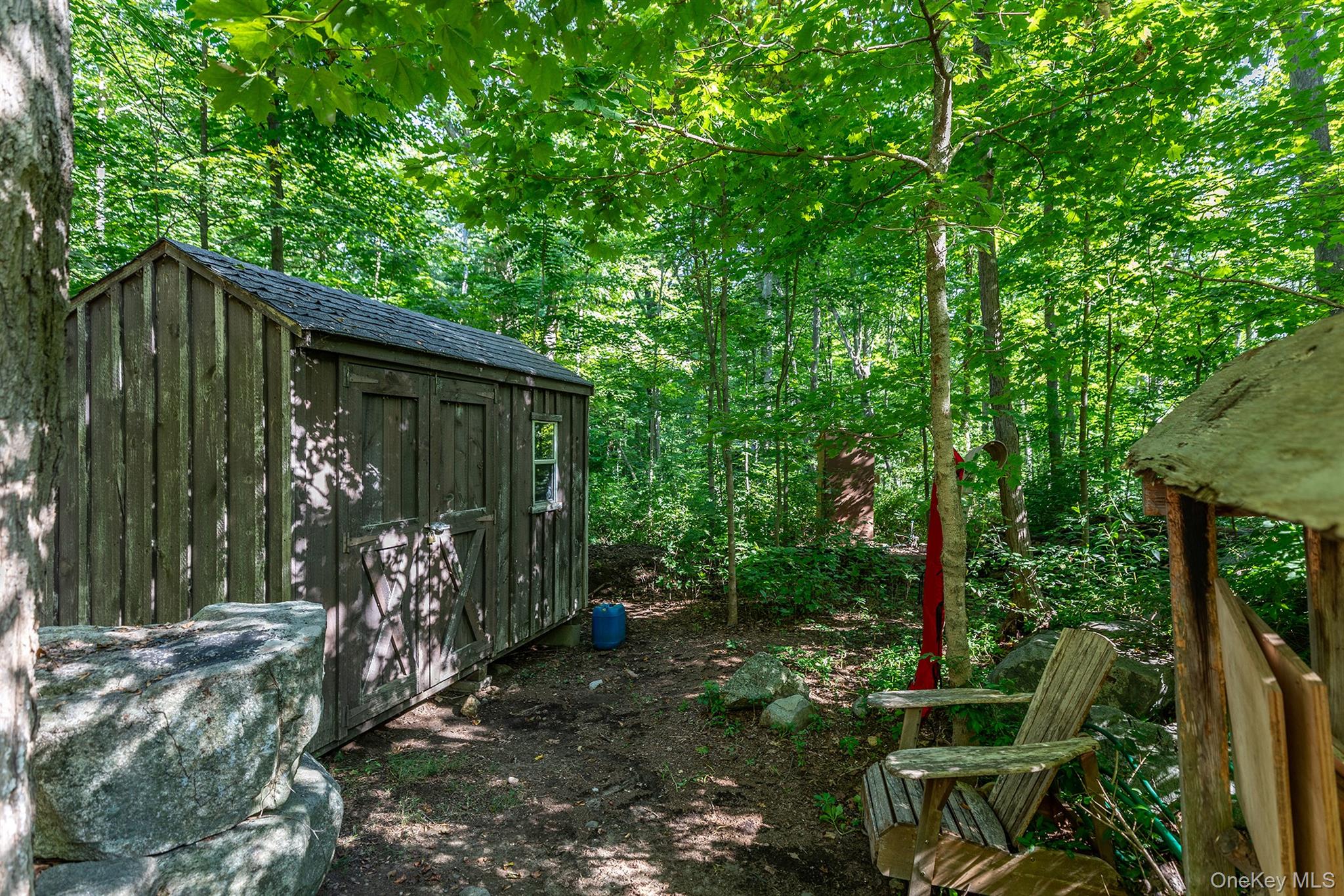 Undisclosed Address Brewster, NY 10509 - Photo 37 of 39 a view of a house with backyard and garden
