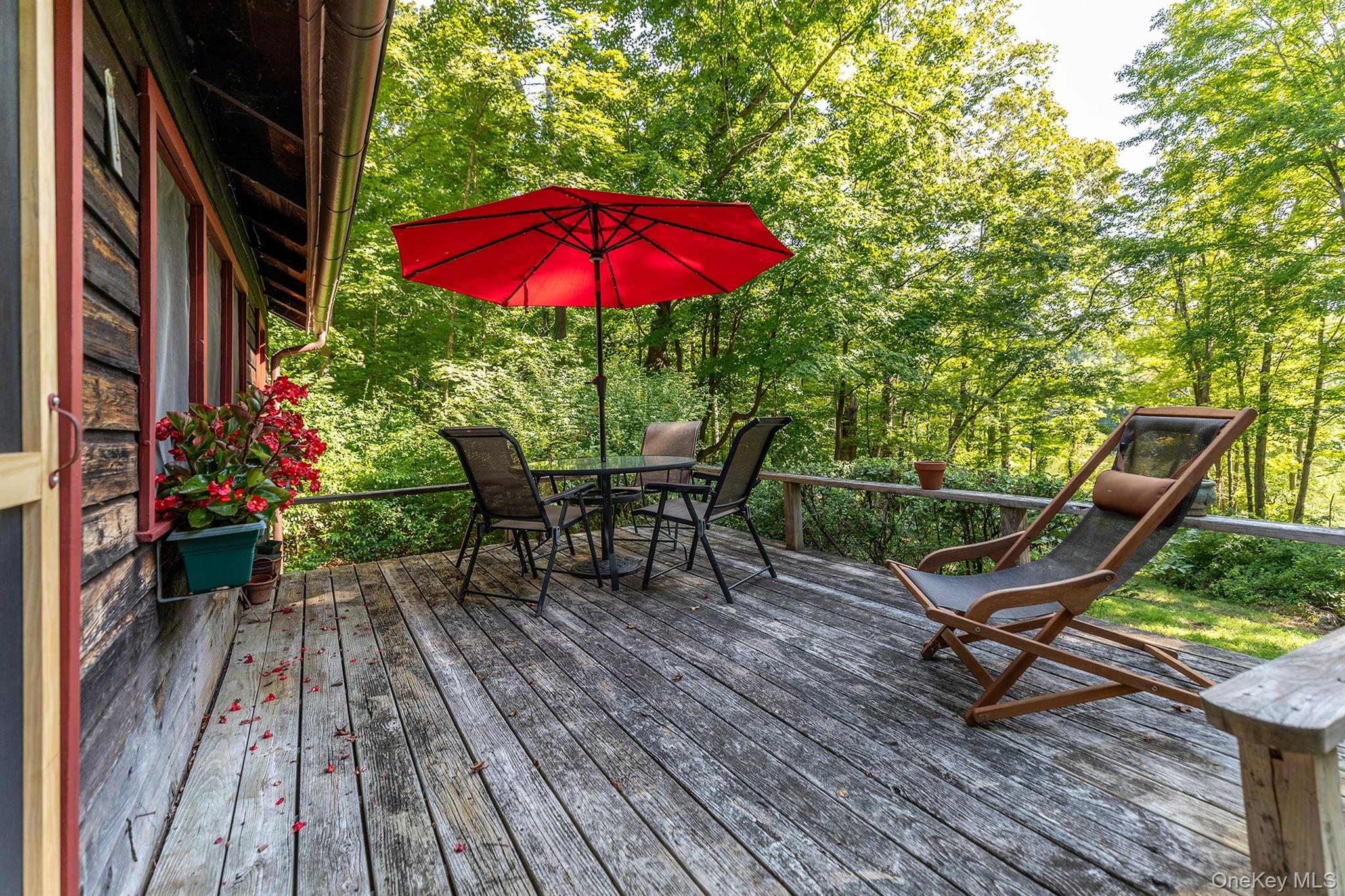 Undisclosed Address Brewster, NY 10509 - Photo 39 of 39 a view of backyard with outdoor seating and wooden floor
