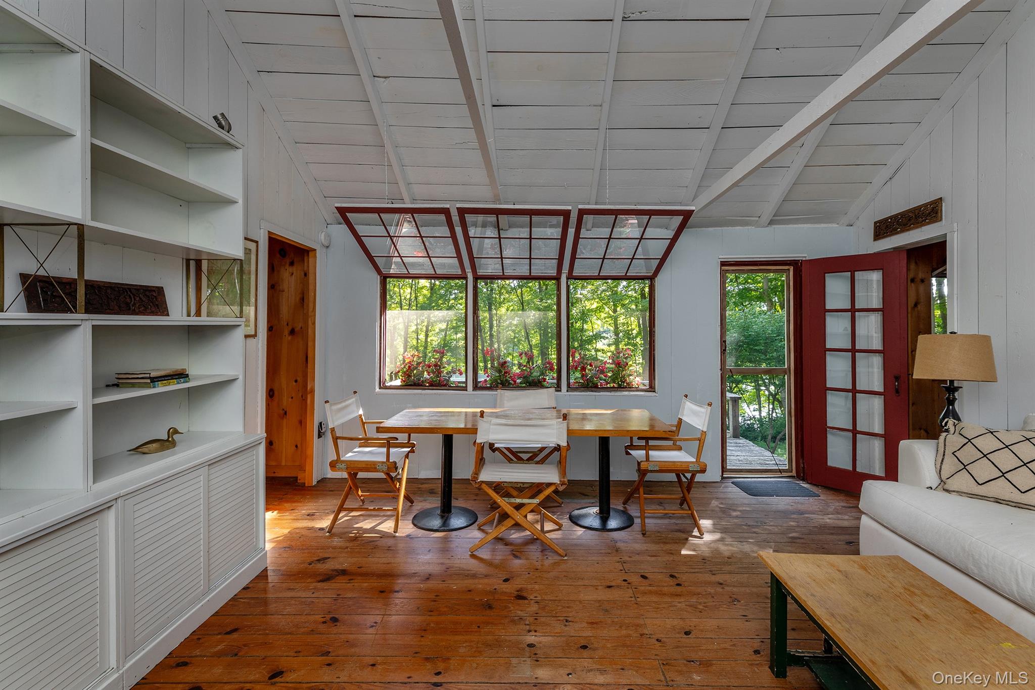 Undisclosed Address Brewster, NY 10509 - Photo 10 of 39 a living room with furniture and large windows