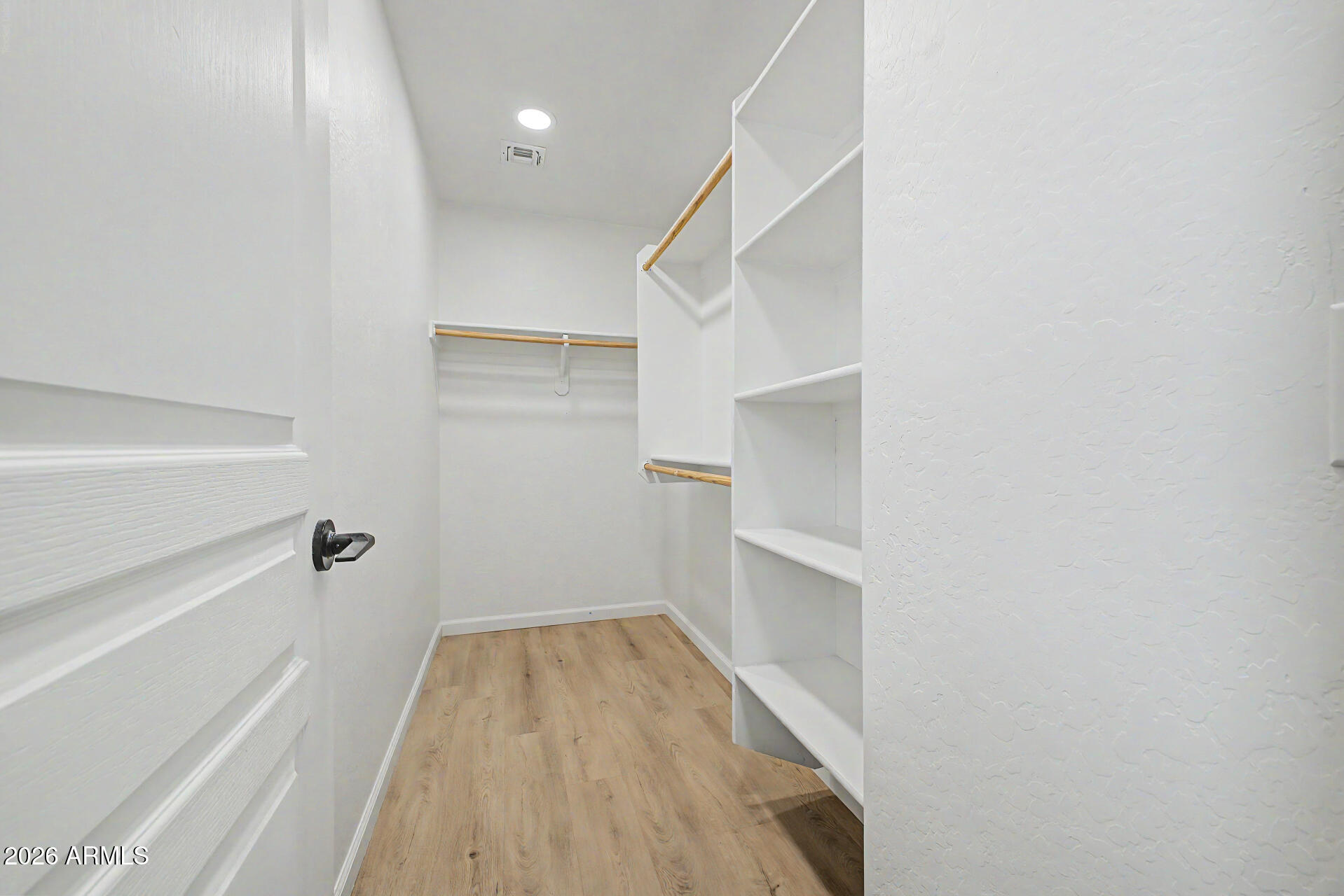 451 South Hawes Road, Unit 27 Mesa, AZ 85208 - Photo 17 of 27 a view of a hallway with wooden floor and entryway