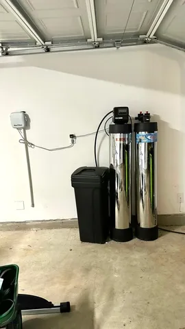 a view of a patio with a table and chairs