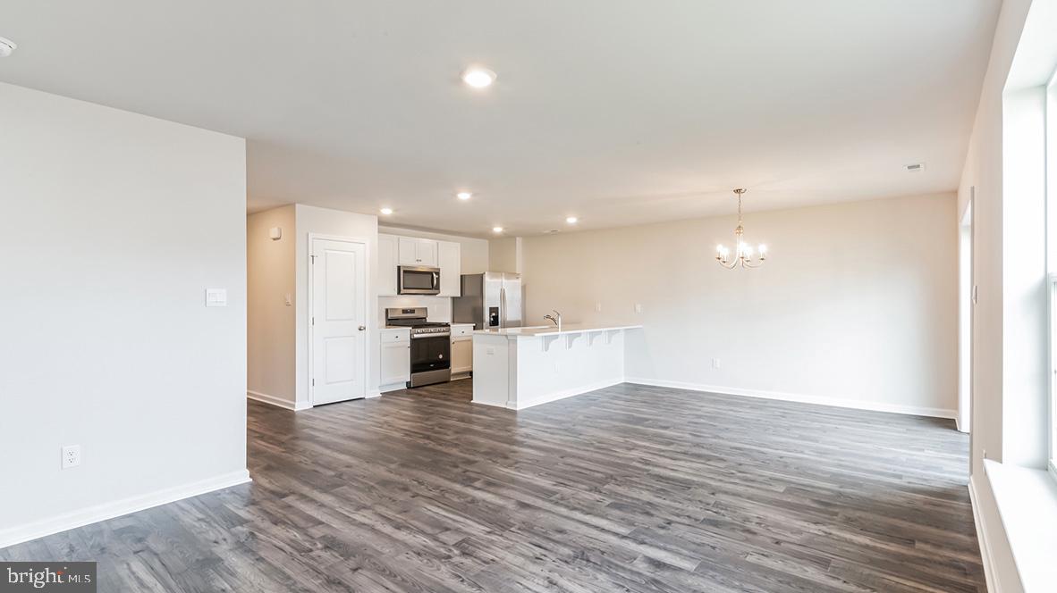 317 Vero Road Egg Harbor Township, NJ 08234 - Photo 5 of 14 a view of kitchen with kitchen island wooden floor center island and stainless steel appliances