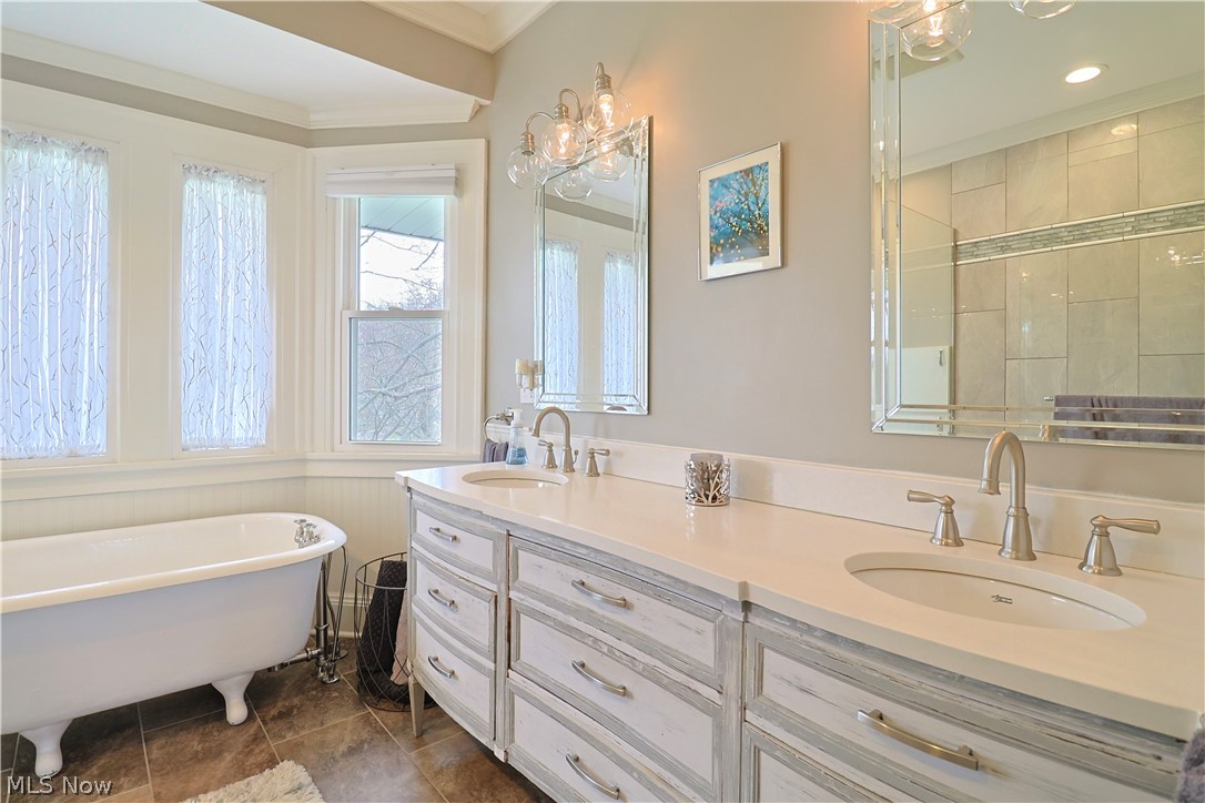 4376 Dover Center Road North Olmsted, OH 44070 - Photo 25 of 34 Bathroom with a washtub, tile flooring, large vanity, and dual sinks