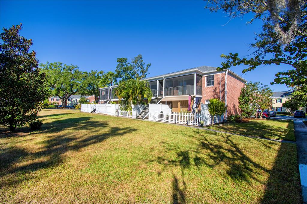 13830 Orange Sunset Drive, Unit 202 Tampa, FL 33618 - Photo 20 of 34 a view of a house with a swimming pool
