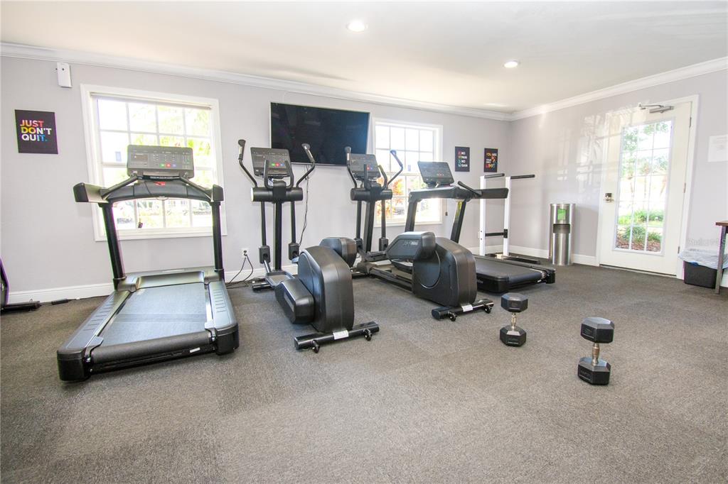 13830 Orange Sunset Drive, Unit 202 Tampa, FL 33618 - Photo 26 of 34 a view of a room with gym equipment