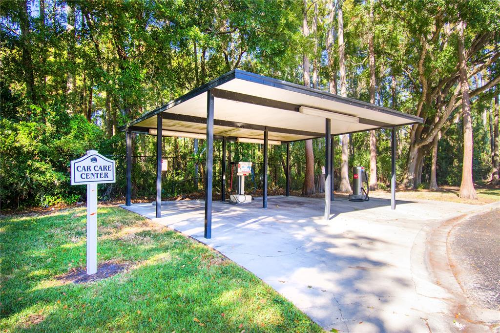 13830 Orange Sunset Drive, Unit 202 Tampa, FL 33618 - Photo 32 of 34 a view of a patio with a table and chairs under an umbrella