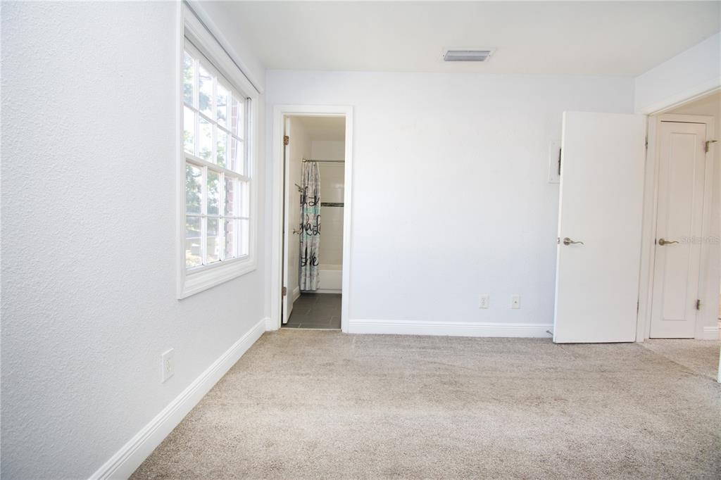 13830 Orange Sunset Drive, Unit 202 Tampa, FL 33618 - Photo 9 of 34 an empty room with windows