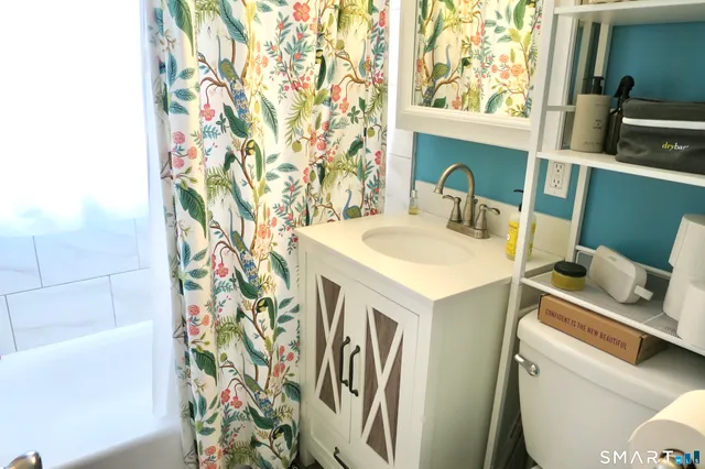 a utility room with a sink a washer and dryer