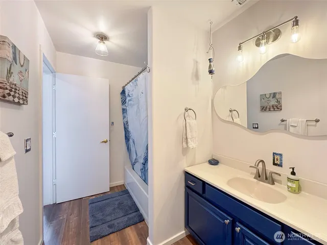 a bathroom with a sink double vanity and a mirror