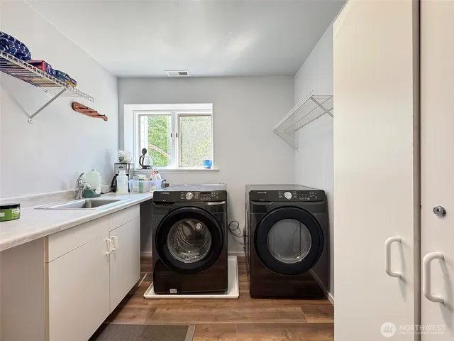 an aerial view of a house with a ocean view