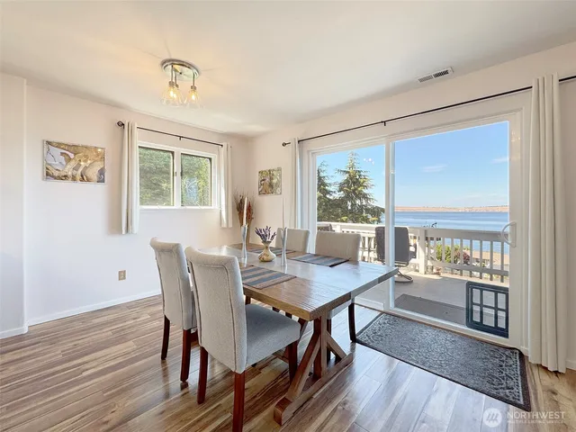 a view of a dining room with furniture window and wooden floor
