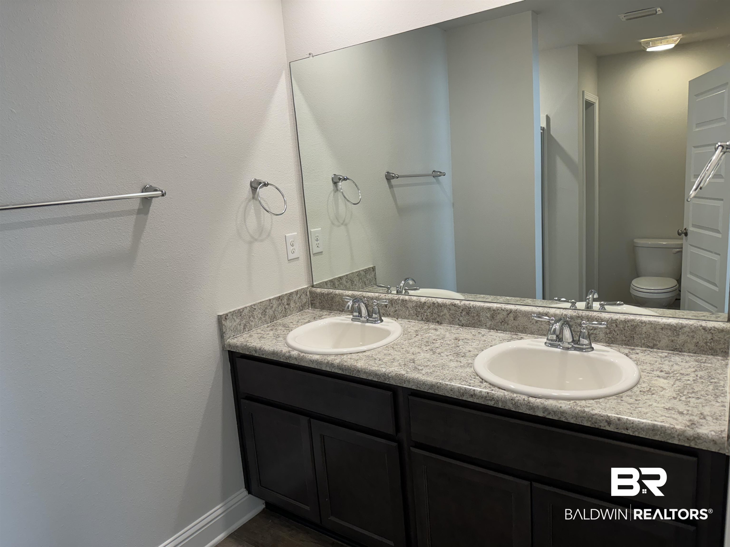 25806 Pollard Road, Unit 42 Daphne, AL 36526 - Photo 13 of 21 Bathroom featuring vanity and toilet