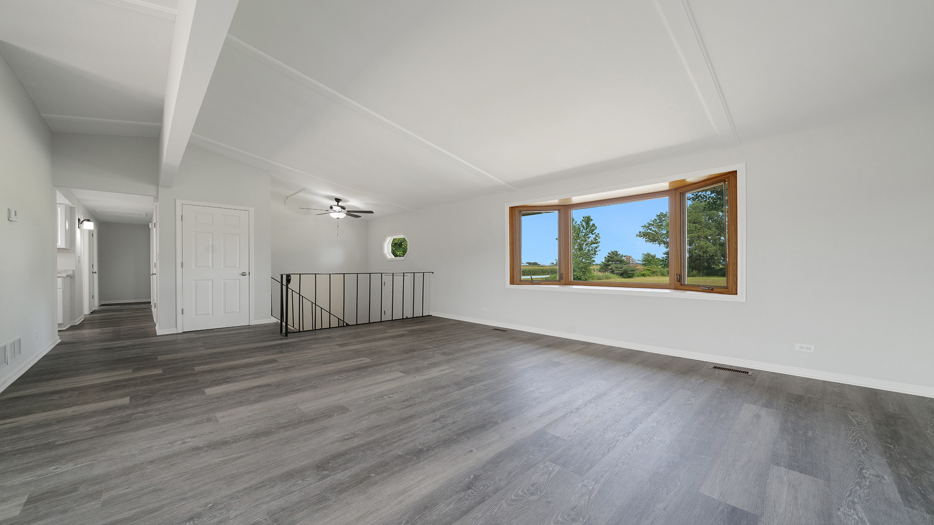 22005 Harmony Road Marengo, IL 60152 - Photo 11 of 49 an empty room with wooden floor and windows