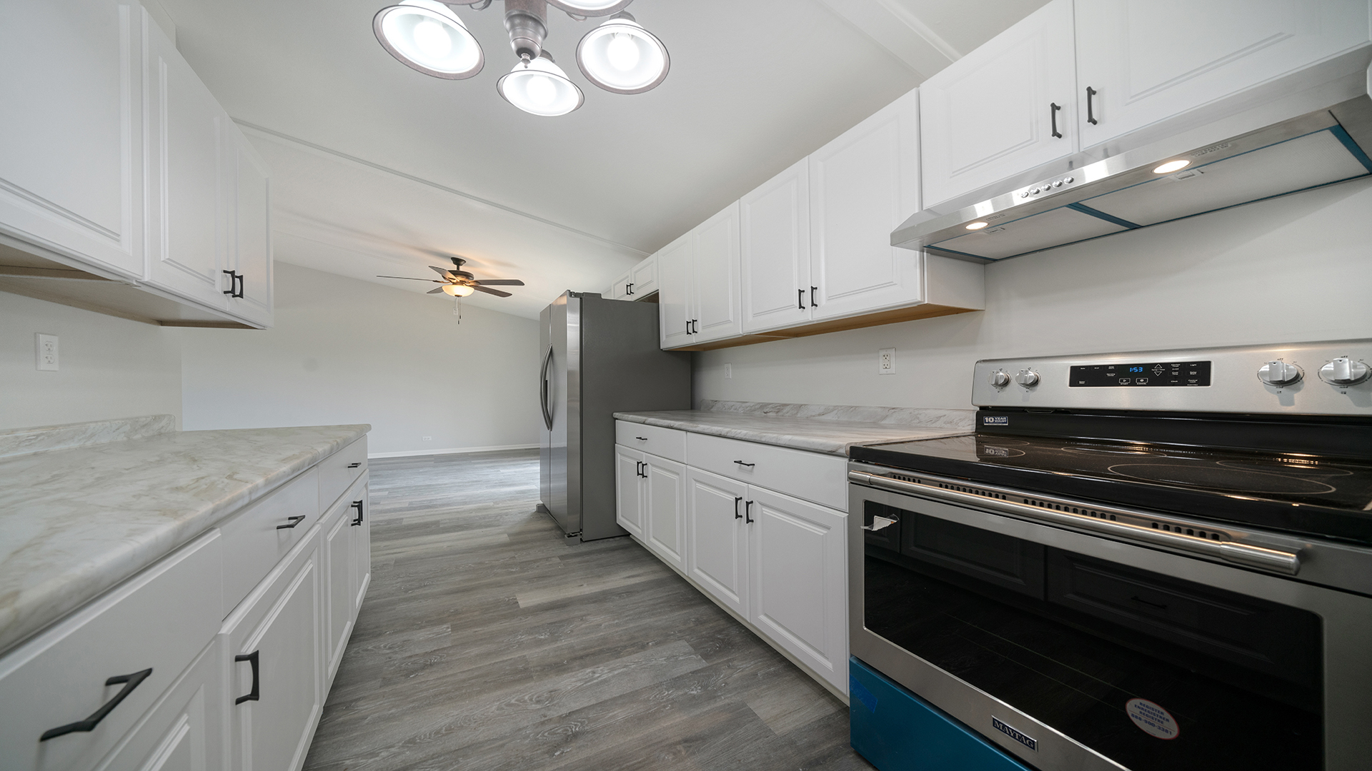 22005 Harmony Road Marengo, IL 60152 - Photo 16 of 49 a kitchen with granite countertop a stove and a sink