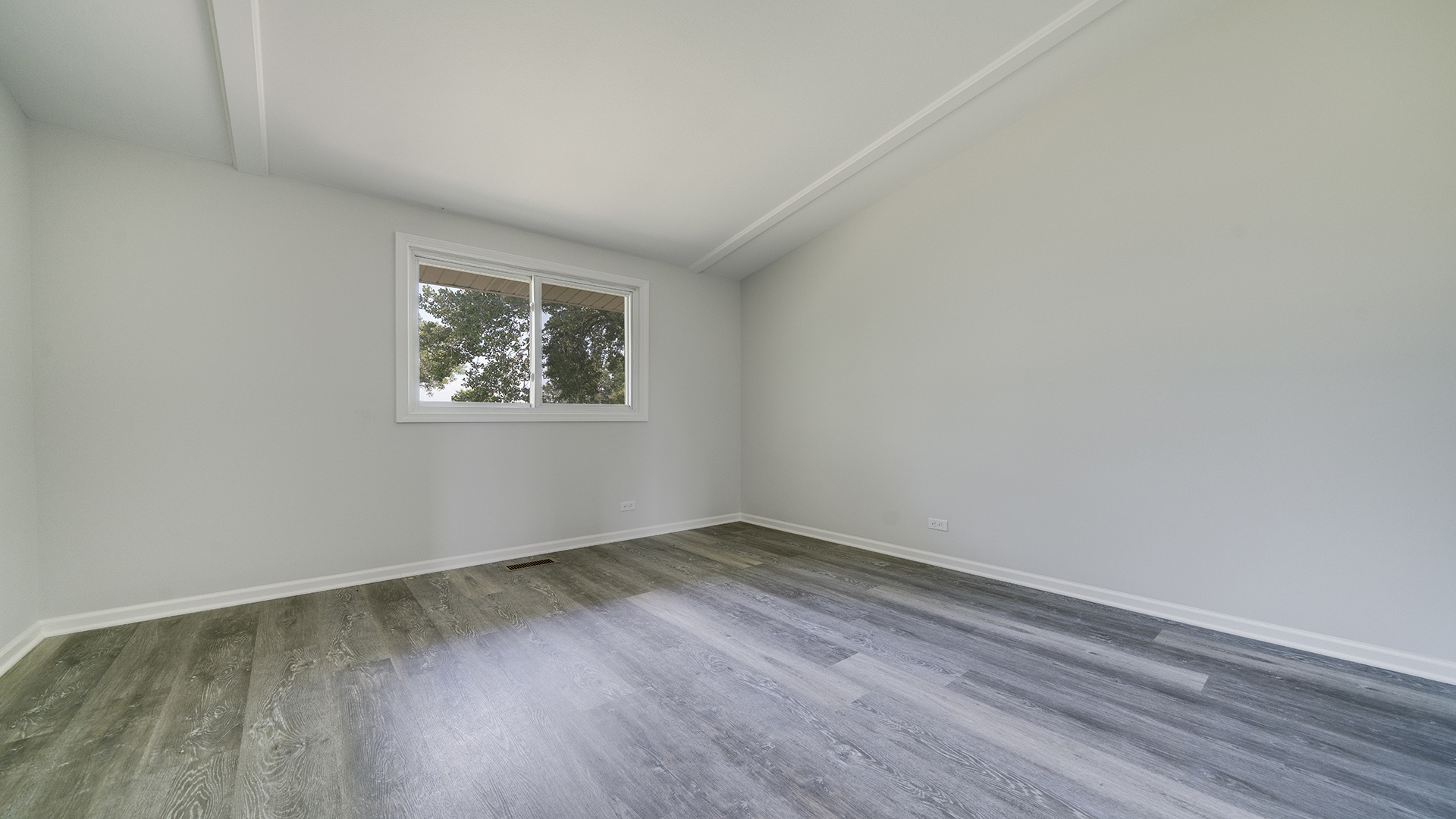 22005 Harmony Road Marengo, IL 60152 - Photo 19 of 49 an empty room with wooden floor and windows