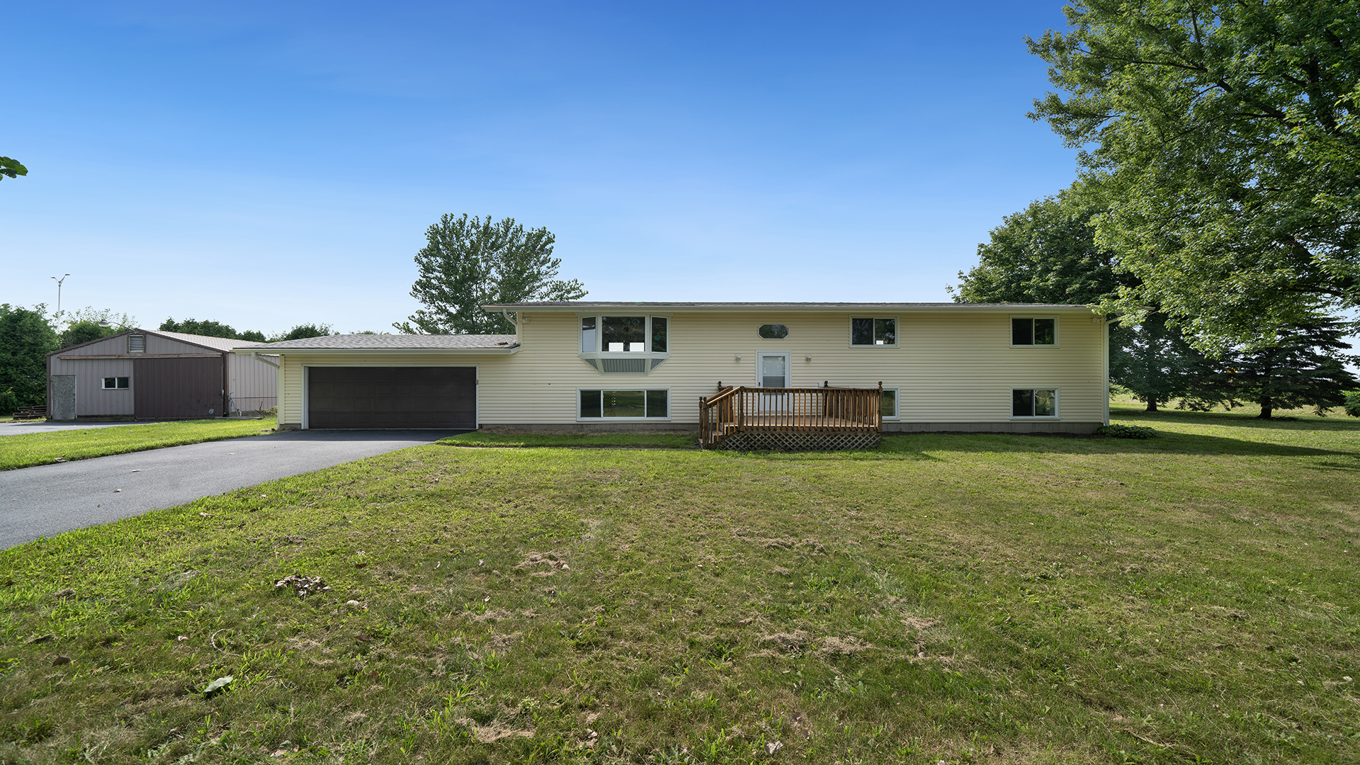 22005 Harmony Road Marengo, IL 60152 - Photo 2 of 49 a front view of a house with a garden and yard