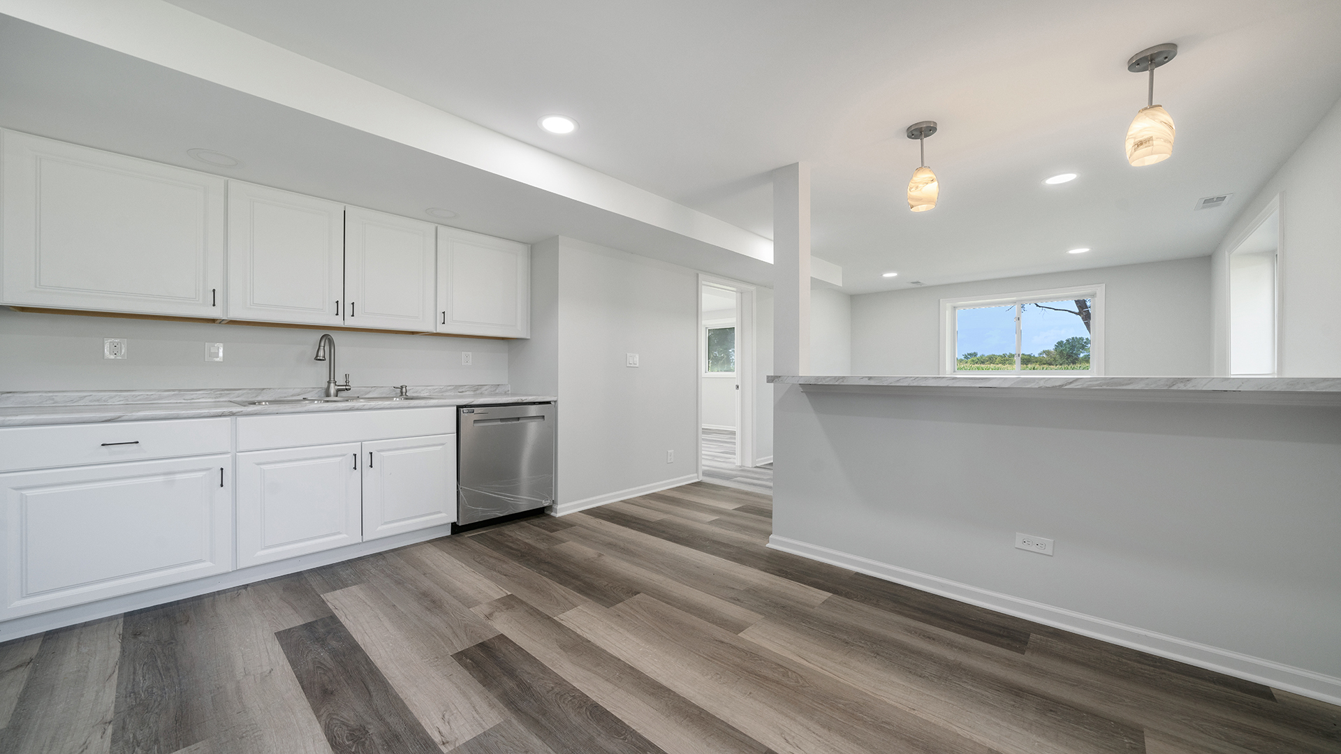 22005 Harmony Road Marengo, IL 60152 - Photo 27 of 49 a kitchen with granite countertop white cabinets and white appliances