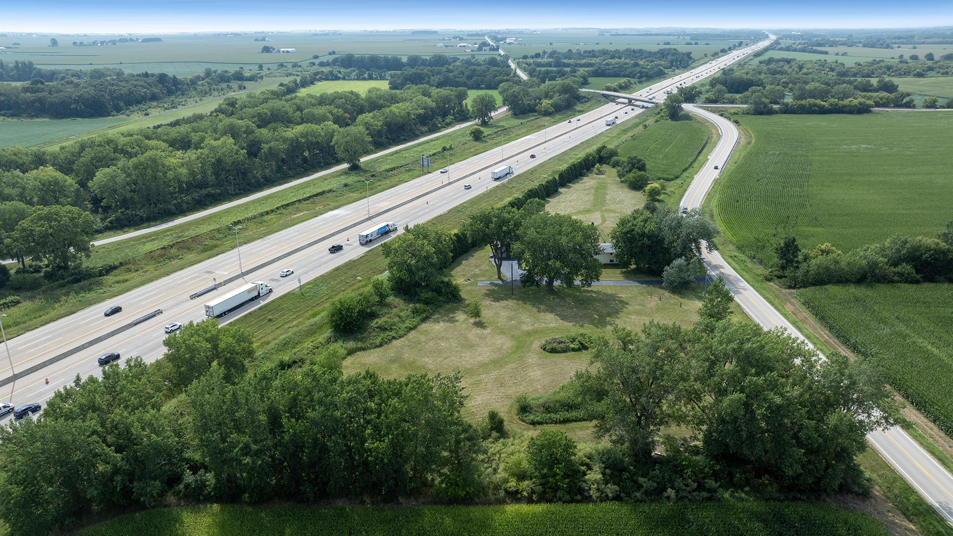 22005 Harmony Road Marengo, IL 60152 - Photo 3 of 49 a view of a lush green forest with a lake view