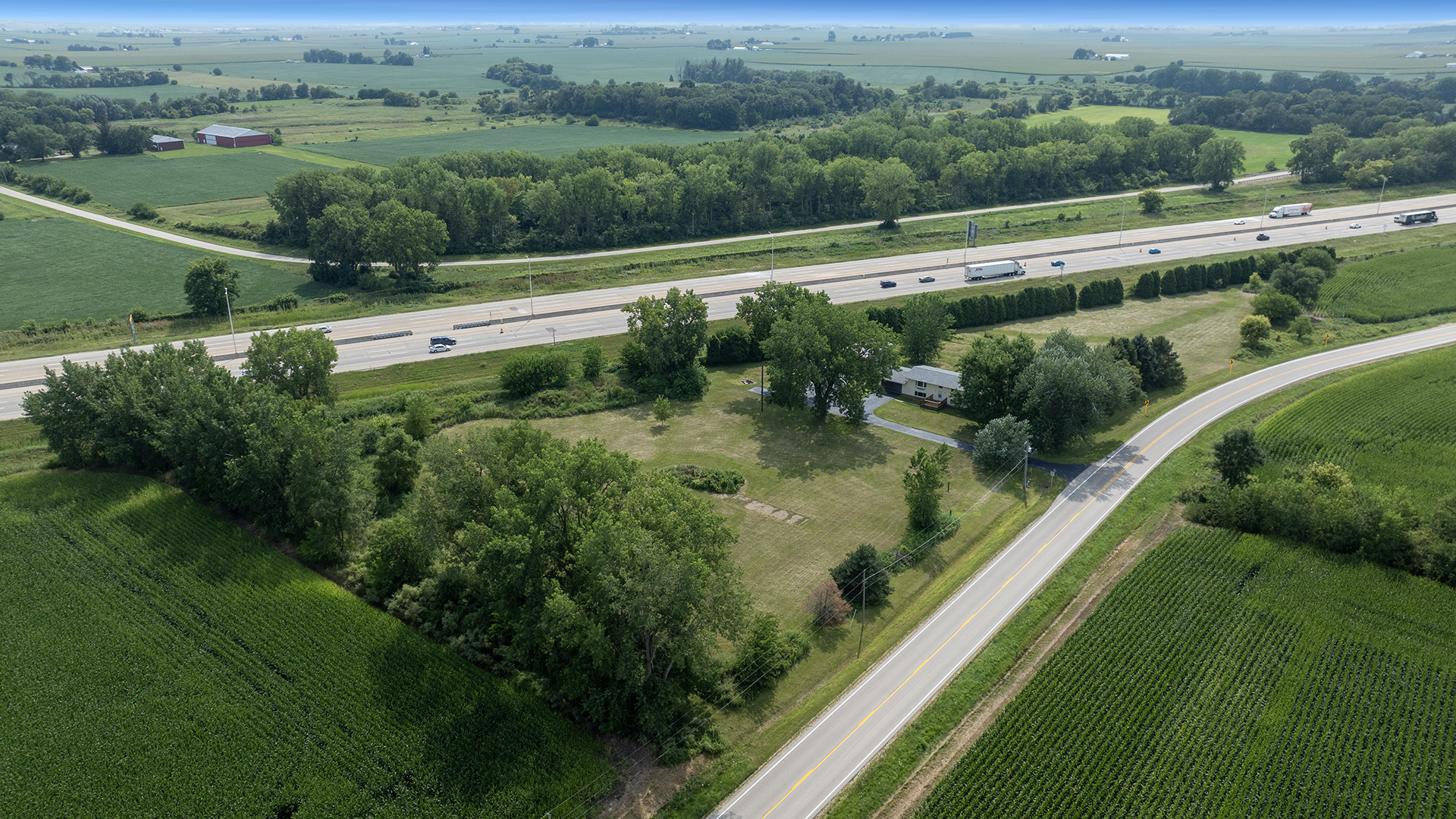 22005 Harmony Road Marengo, IL 60152 - Photo 4 of 49 a view of a lake with huge green field with lots of green space