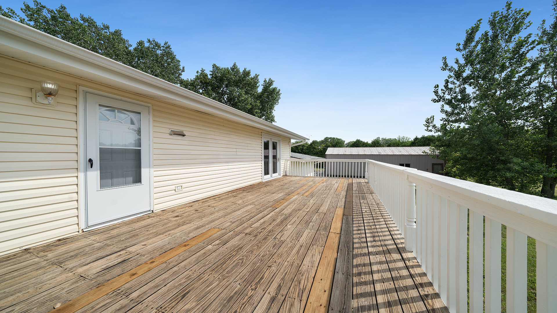22005 Harmony Road Marengo, IL 60152 - Photo 43 of 49 a view of a balcony with wooden floor and fence