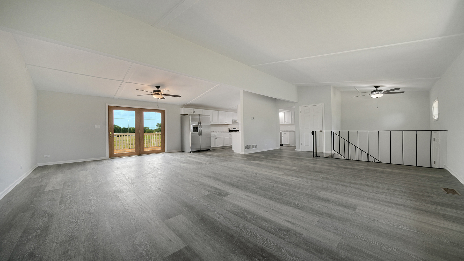 22005 Harmony Road Marengo, IL 60152 - Photo 10 of 49 an empty room with wooden floor and windows