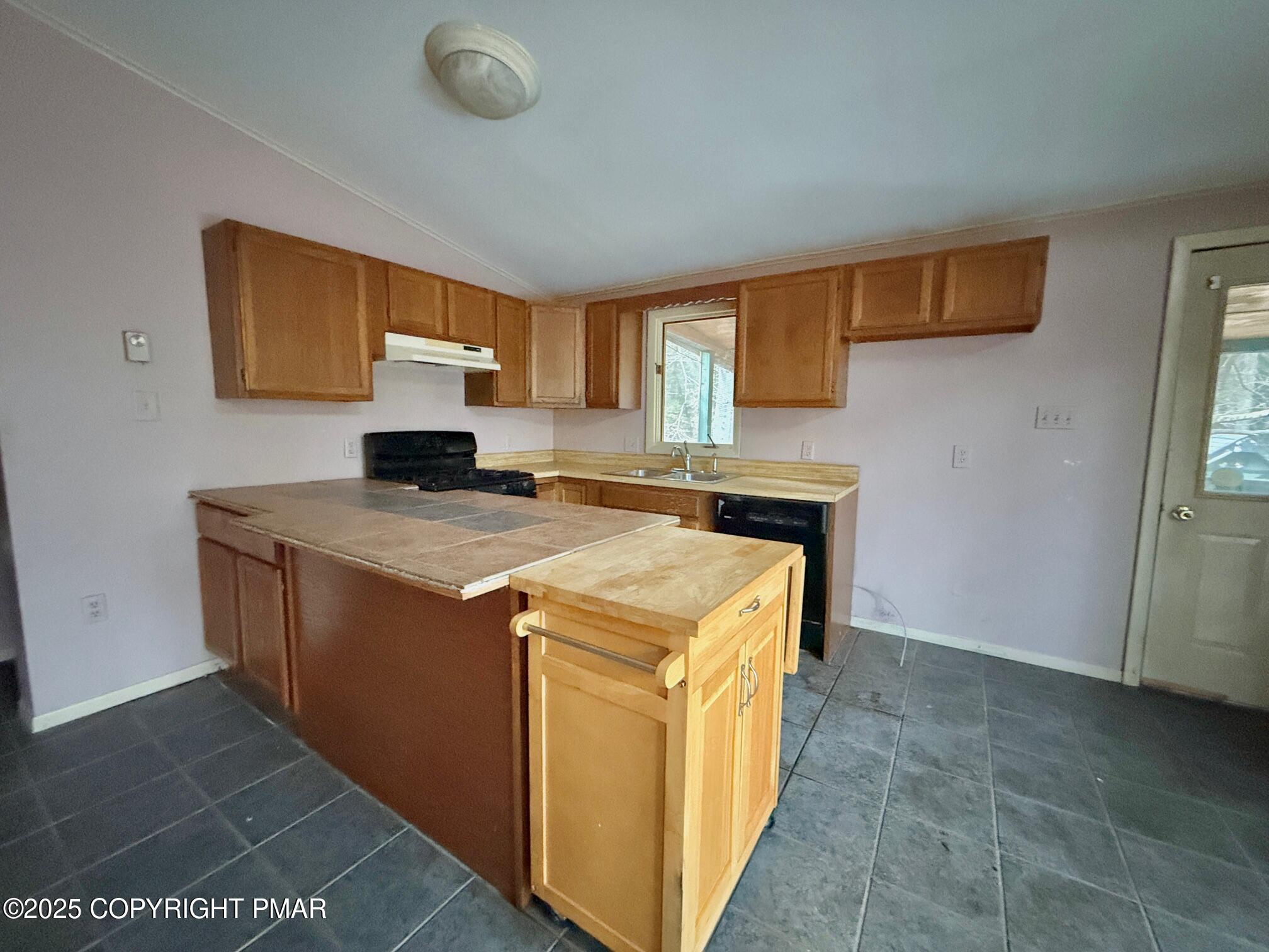 136 Pine Run Pocono Lake, PA 18347 - Photo 11 of 23 a kitchen with a stove and a sink