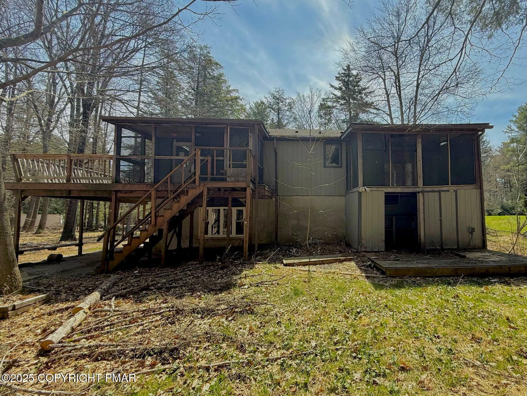 136 Pine Run Pocono Lake, PA 18347 - Photo 3 of 23 a view of backyard with green space