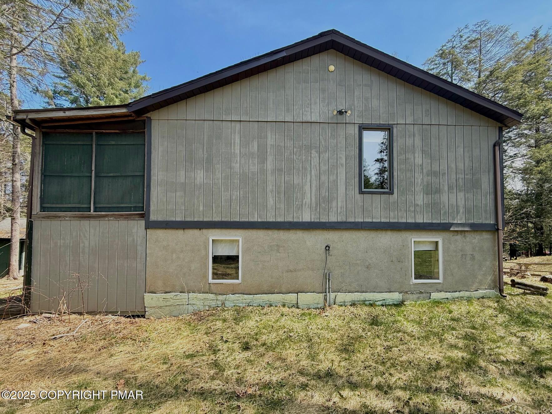 136 Pine Run Pocono Lake, PA 18347 - Photo 4 of 23 a view of a backyard of a house