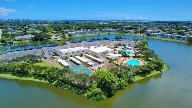 an aerial view of a house with a lake view
