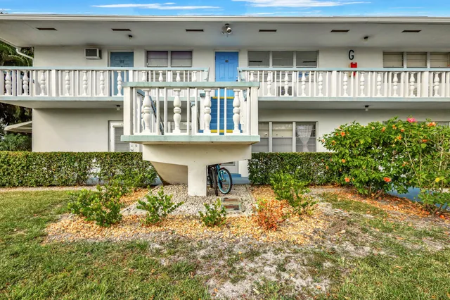 a house with lots of trees in the background