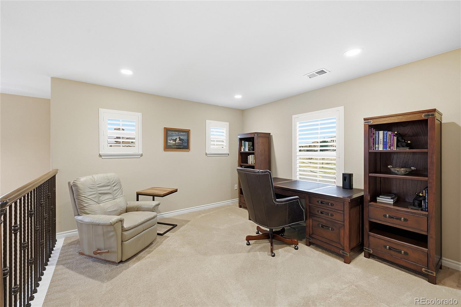 9500 Pendio Court Highlands Ranch, CO 80126 - Photo 15 of 15 a view of a livingroom with workspace and a window