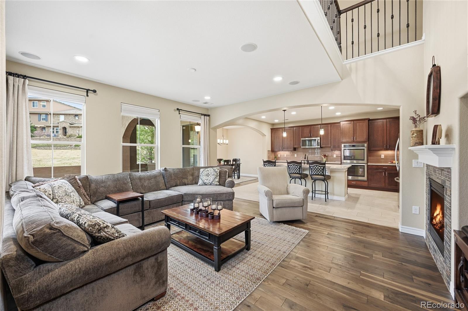 9500 Pendio Court Highlands Ranch, CO 80126 - Photo 2 of 15 a living room with furniture fireplace and a window